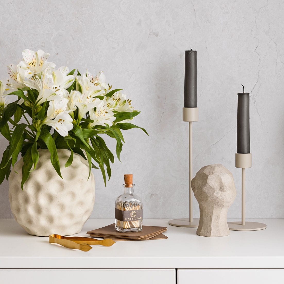 Lilla Tändsticksburk, Aska